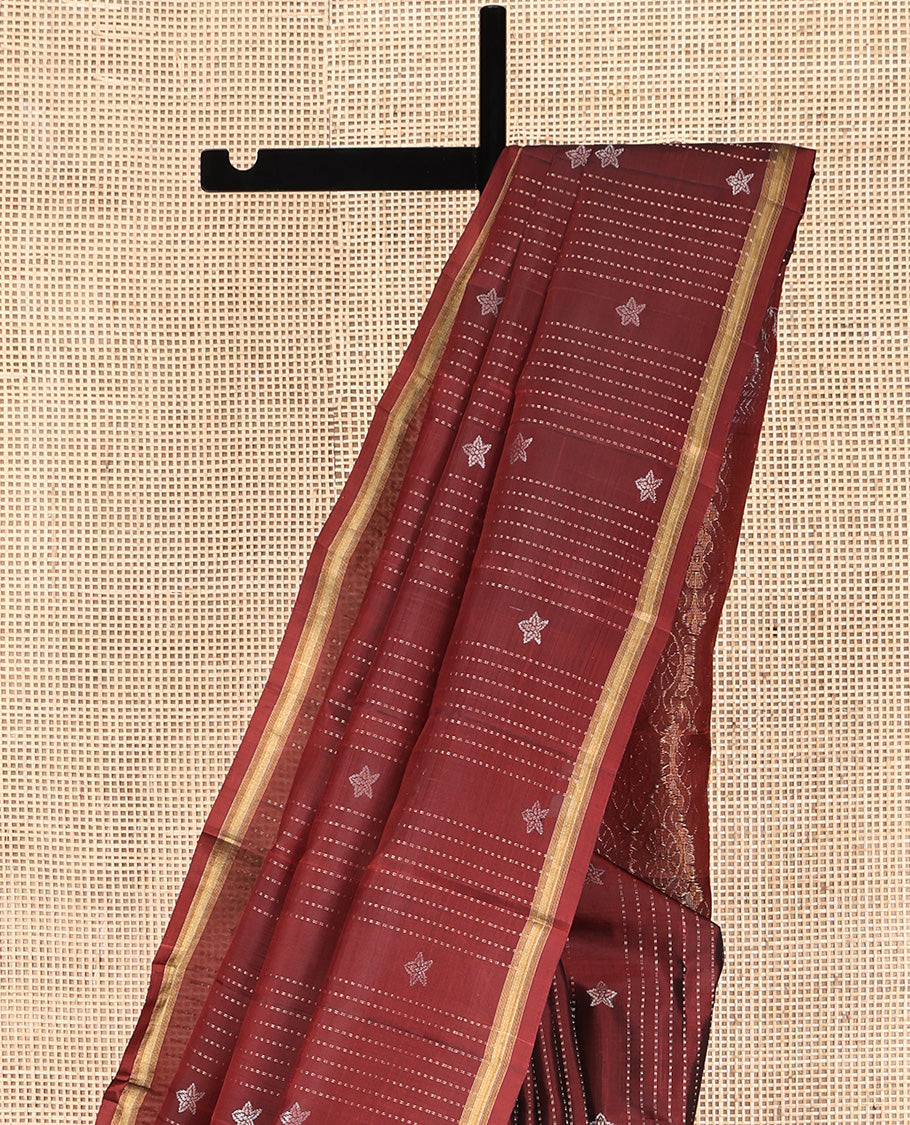 Maroon Mayuri Lite Silk Mix Saree, Adorned with Buttas and Muthu Stripes All Over Its Body, Highlighted by a Zari Border, Pallu of Intricate Designs, and Paired with a Matching Blouse