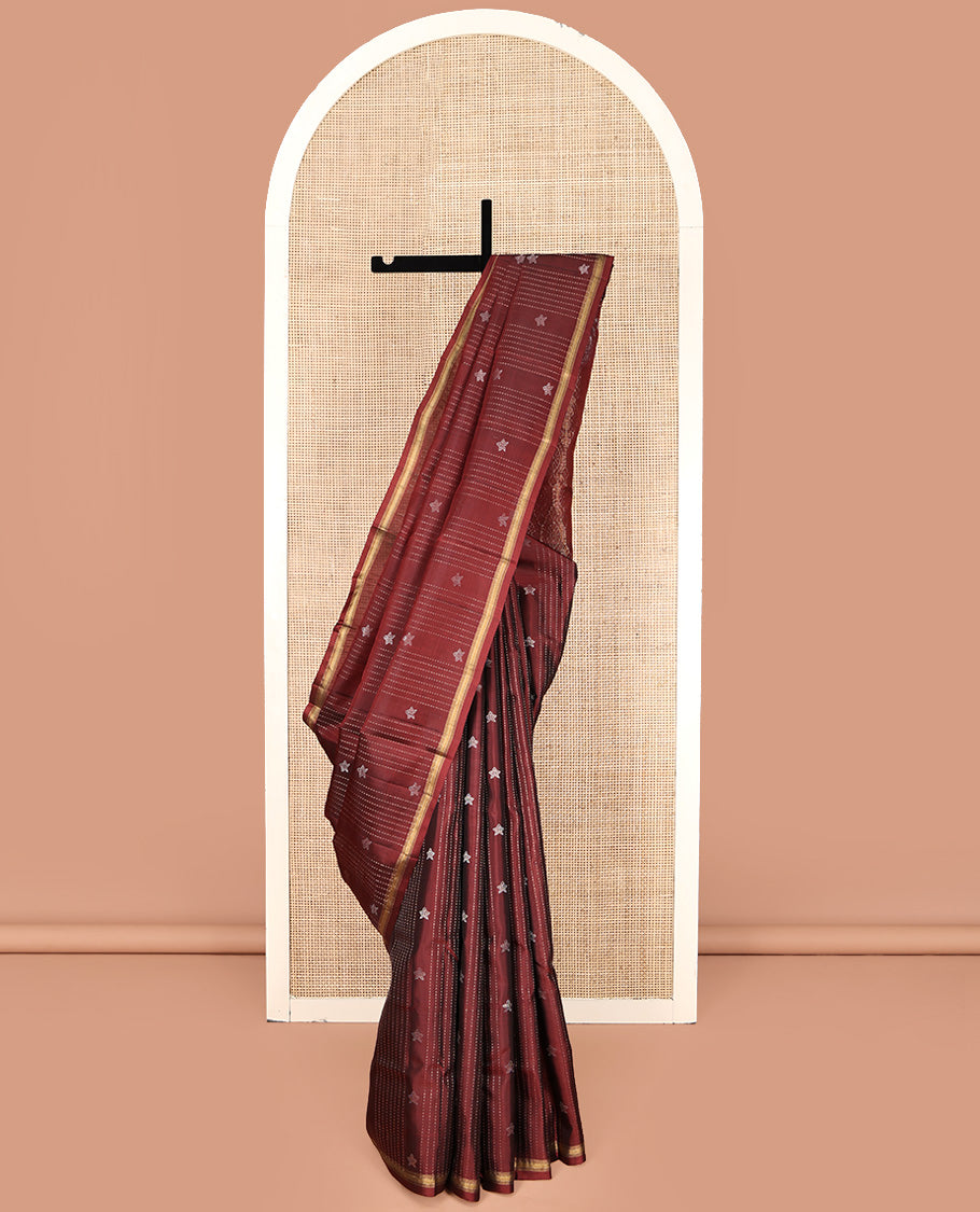 Maroon Mayuri Lite Silk Mix Saree, Adorned with Buttas and Muthu Stripes All Over Its Body, Highlighted by a Zari Border, Pallu of Intricate Designs, and Paired with a Matching Blouse