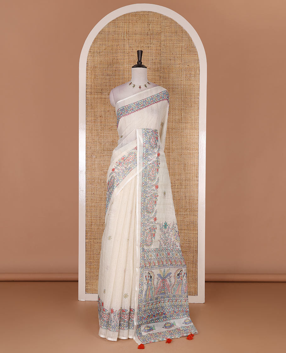 Cream madhubani-style floral buttas printed linen saree, madhubani peacock printed border, madhubani printed pallu, and madhubani village printed blouse