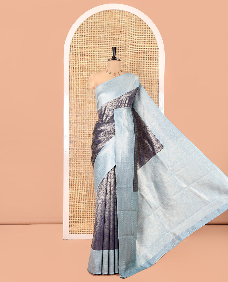 Navy Blue Kanchi Silk Saree, Prettified with Floral Jacquard Design on Its Body, Complemented by a Contrast Traditional Zari Design Border, Sparsely Woven Pallu, and Paired with a Contrast Blouse