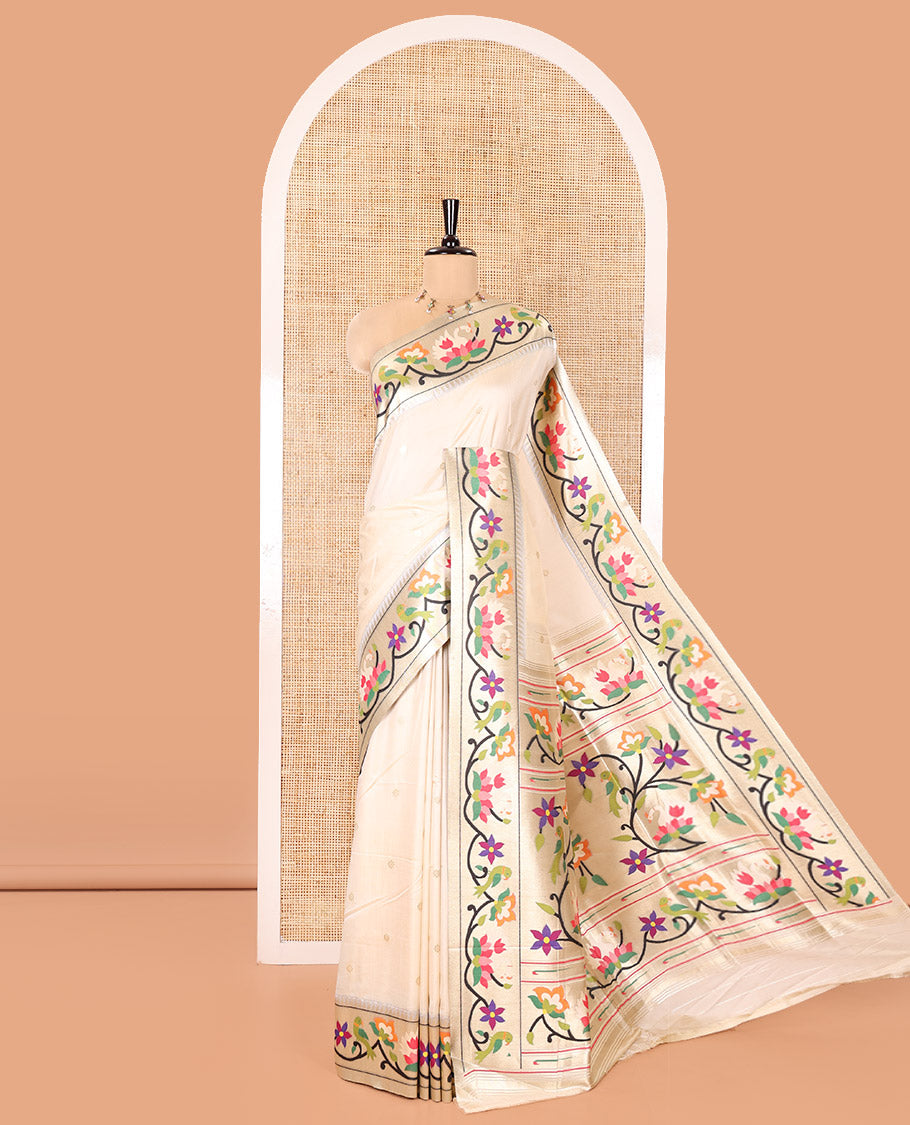 Half-White Paithani Art Silk Saree, Enthralled with Flower Buttas All Over Its Body, Highlighted by Zari Border Pictures Colorful Floral, and Parrot Designs, Pallu of Muniya, Floral and Parrot Designs, and Paired with a Matching Blouse