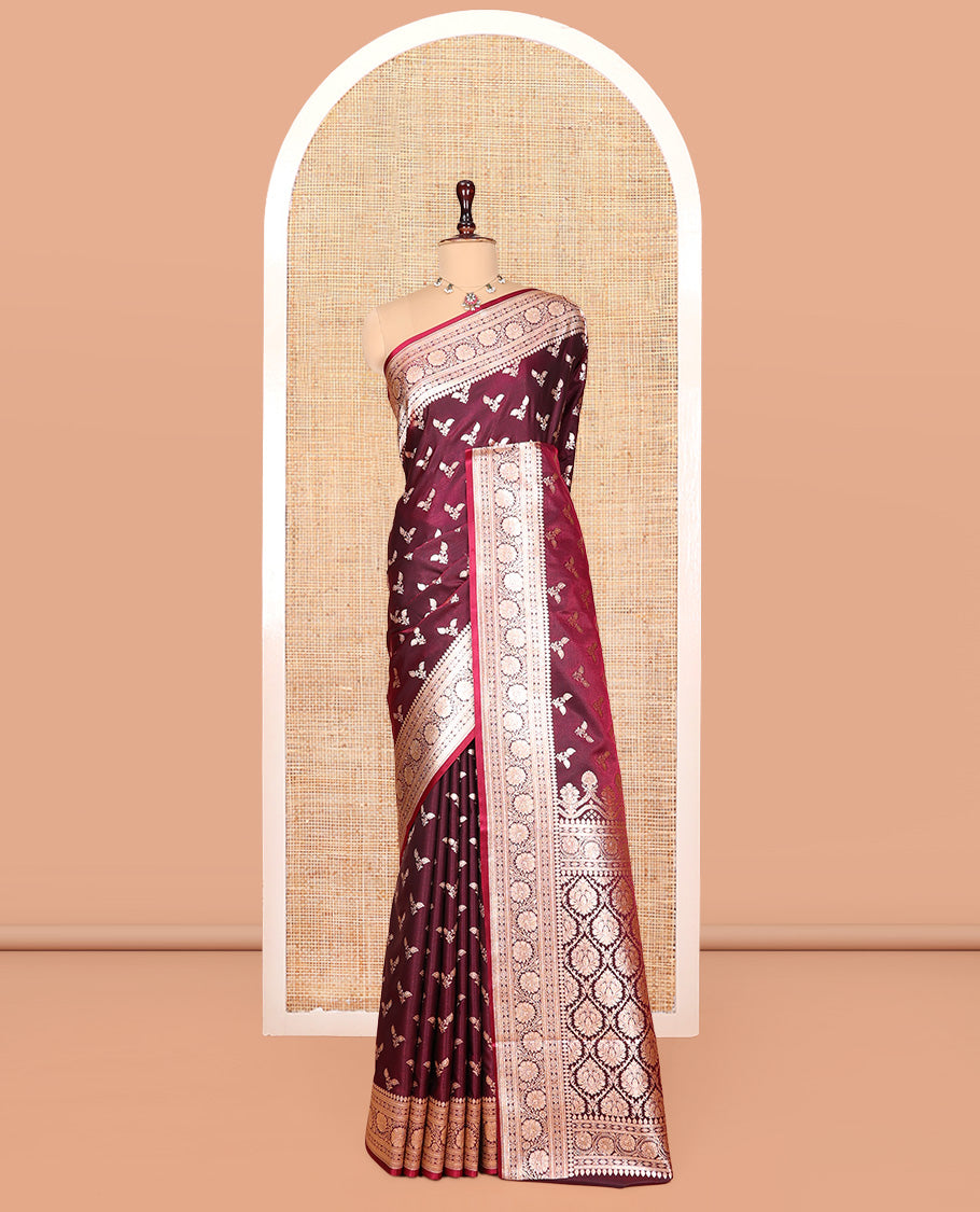 Maroon Banarasi Nylon Saree, Gleamed Up with Buttas, a Floral Creeper Zari Border, Intricate Pallu, and a Matching Blouse