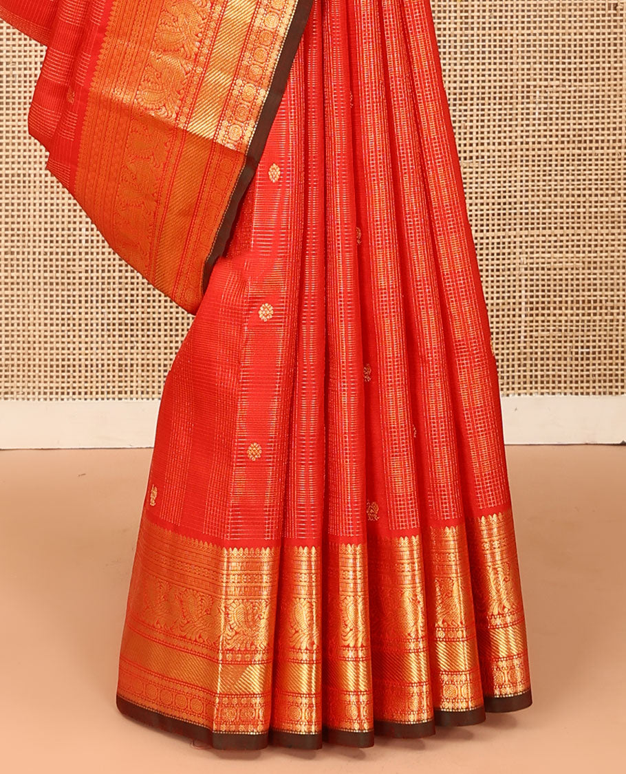 Red zari checked and buttas Kanchipuram silk saree, zari border of thilakam mokku, banaras, kamalam, mayil, and chakram designs, and jaal pallu