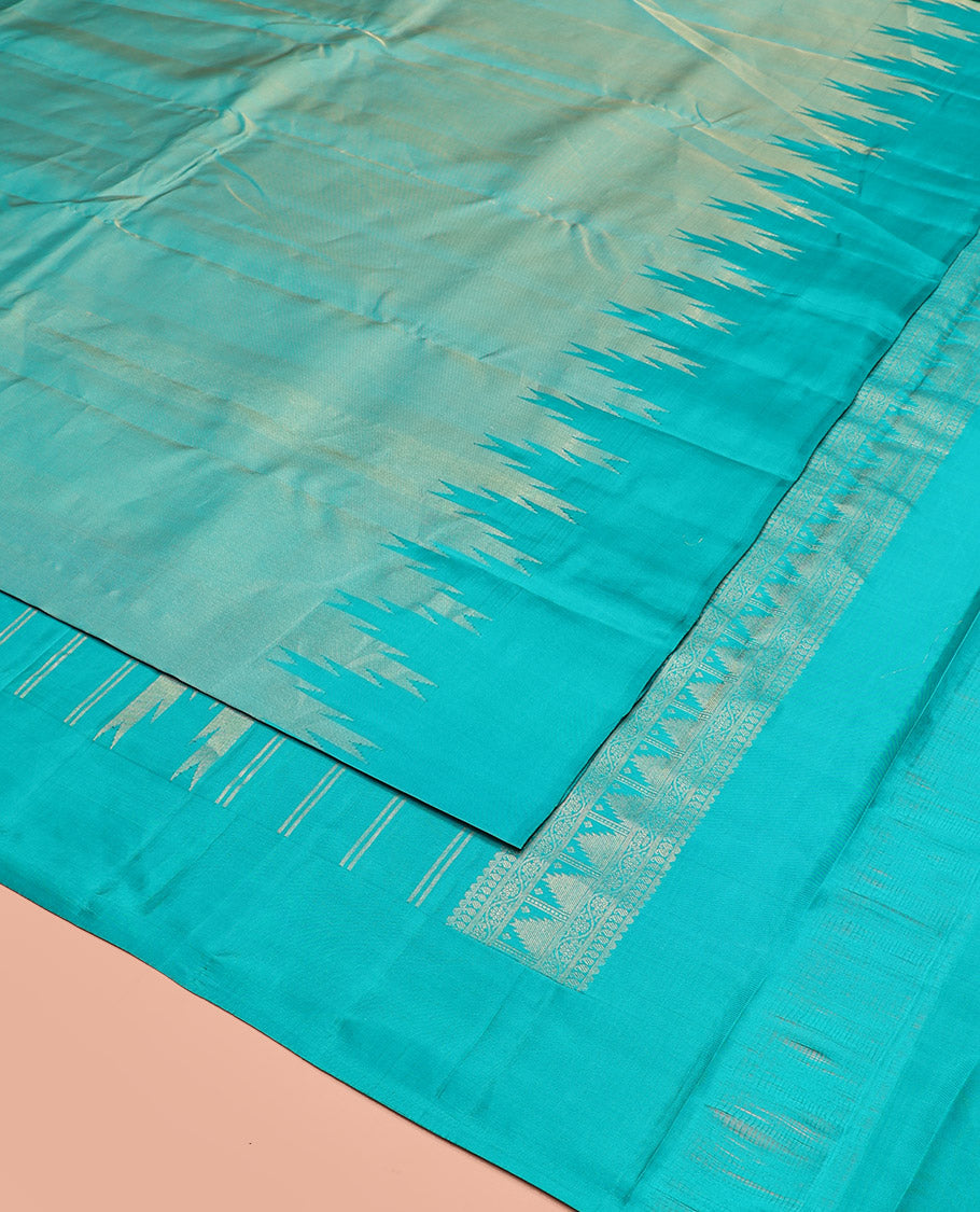 Blue Vasundhara Silk Saree Gleamed Up with Thazampoo Rekku Border, Pallu of Manga, Kodi Visiry, and Thazampoo Rekku Designs, and Paired with a Matching Blouse
