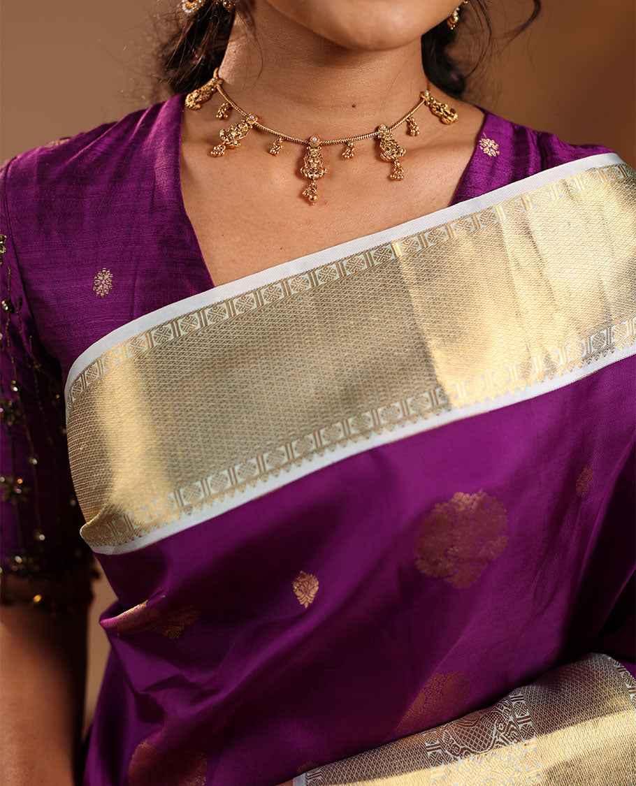Purple Vasundhara Silk Saree Adorned with Zari Buttas, Enthralled with a Contrast Border of Mayil Kann, Mayil, and Rudraksham Designs, Complemented by a Pallu of Intricate Zari Designs, and Paired with a Contrast Blouse