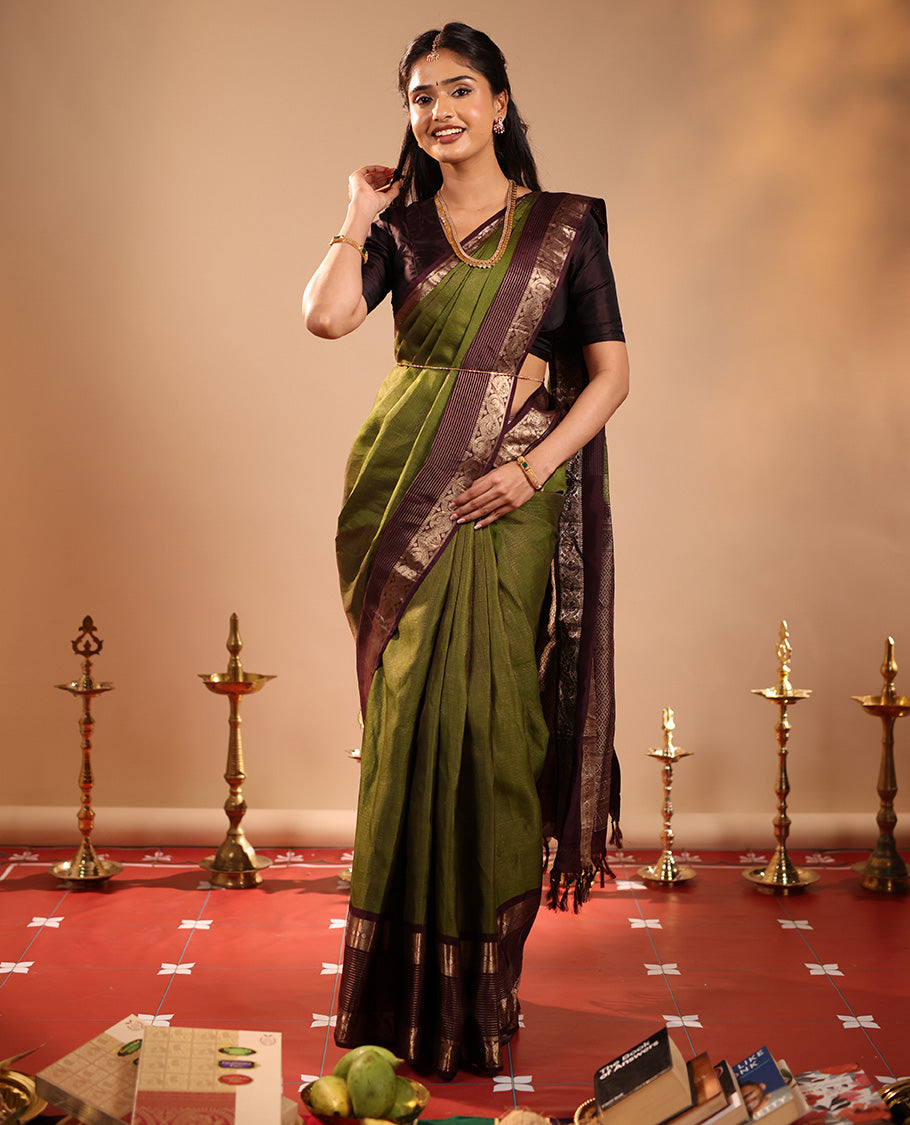 Green Vasundhara Silk Saree Mesmerized with Zari Micro-Checks All Over Its Body, Complemented by a Contrast Border of Rekku, Kamalam, Mayil Kann, Yaanai and Mayil Designs, Subtly Sparkled Pallu of Jaal Designs, and Paired with a Contrast Blouse