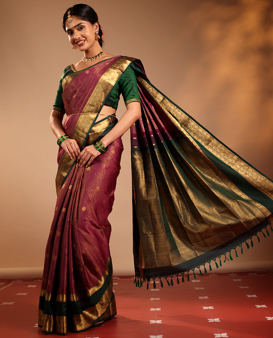 Magenta Vasundhara Silk Saree Featuring Zari Checks and Annam Chakram Buttas, Complemented by a Contrast Rettai Pettu Border with Muthu, Yaali, and Kodi Visiry Designs, a Jaal Pallu, and a Contrast Zari-Bordered Blouse
