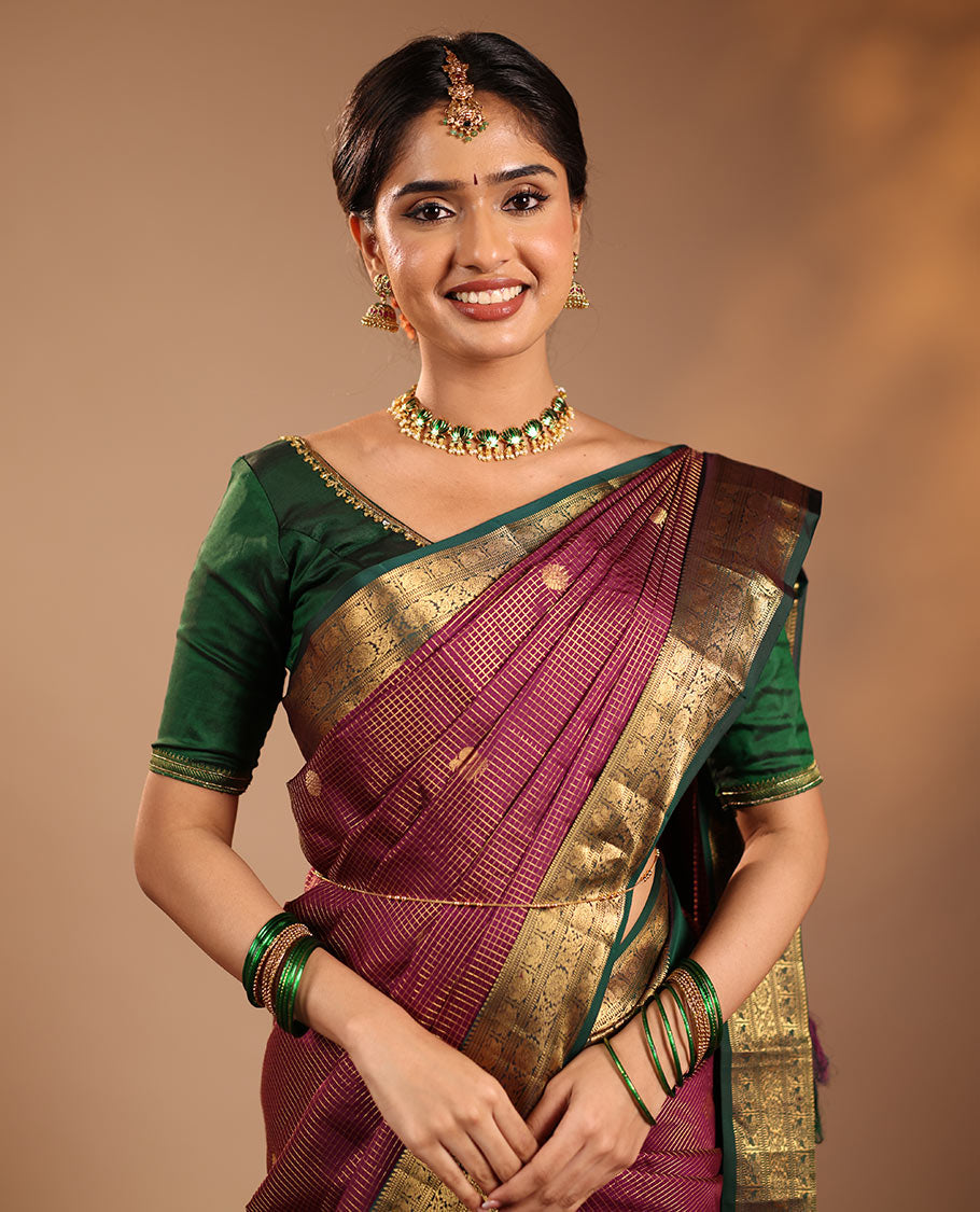 Magenta Vasundhara Silk Saree Featuring Zari Checks and Annam Chakram Buttas, Complemented by a Contrast Rettai Pettu Border with Muthu, Yaali, and Kodi Visiry Designs, a Jaal Pallu, and a Contrast Zari-Bordered Blouse