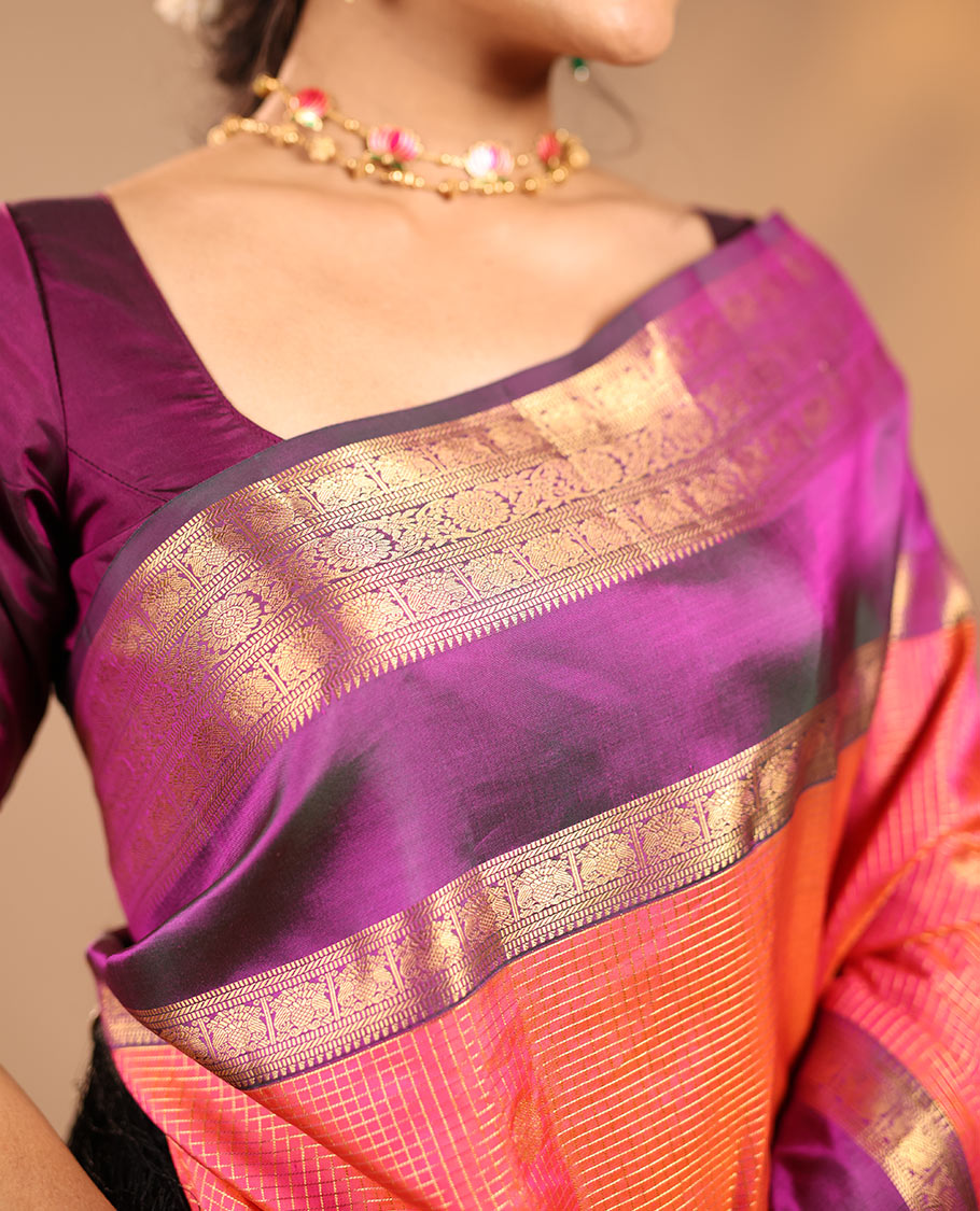 Orange Vasundhara Silk Saree Featuring Zari Checks and Annam Chakram Buttas, Complemented by a Contrast Rettai Pettu Border with Muthu, Yaali, and Kodi Visiry Designs, a Jaal Pallu, and a Contrast Zari-Bordered Blouse