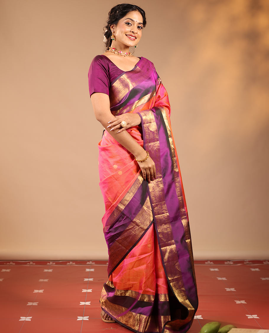 Orange Vasundhara Silk Saree Featuring Zari Checks and Annam Chakram Buttas, Complemented by a Contrast Rettai Pettu Border with Muthu, Yaali, and Kodi Visiry Designs, a Jaal Pallu, and a Contrast Zari-Bordered Blouse