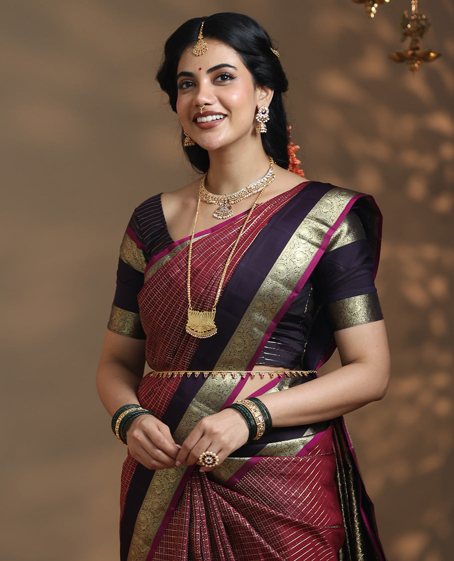 Maroon vaira oosi checked Vasundhara silk saree, contrast rettai pettu border of kodi mayil designs, jaal pallu, and zari design blouse