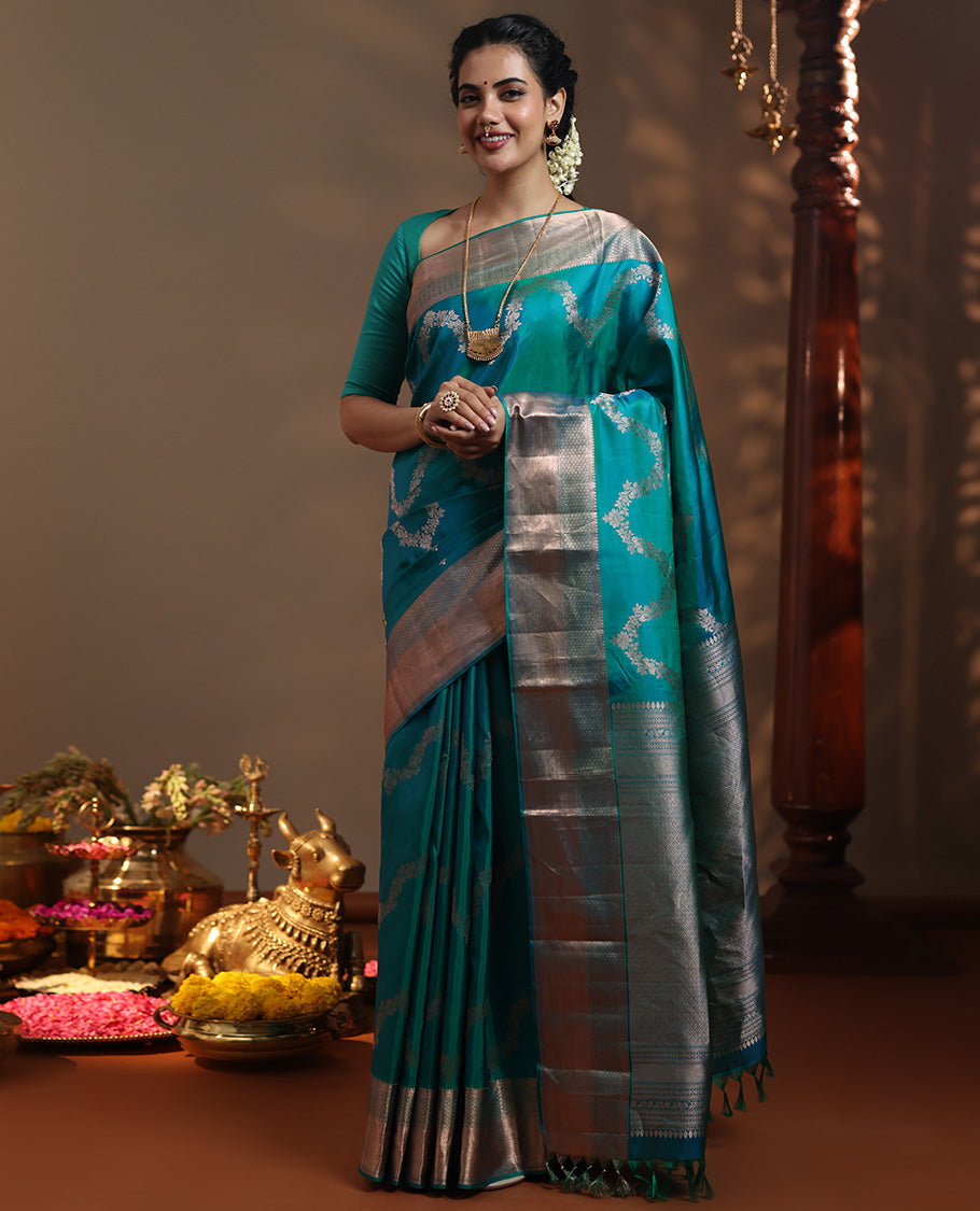 Peacock blue floral jaal jacquard Vasundhara silk mix saree, zari border of thilakam mokku, lavangam, and jaal designs, intricate pallu, and zari design blouse