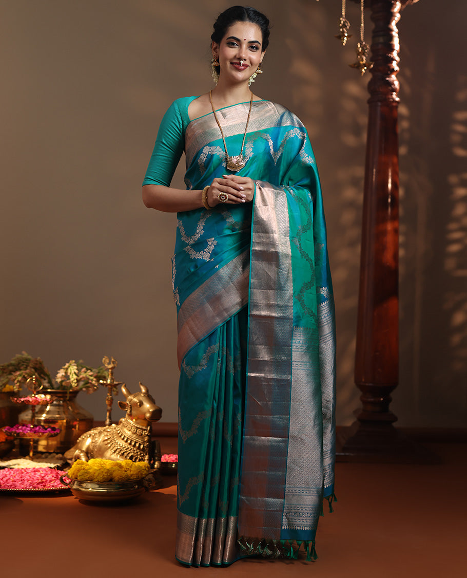 Peacock blue floral jaal jacquard Vasundhara silk mix saree, zari border of thilakam mokku, lavangam, and jaal designs, intricate pallu, and zari design blouse