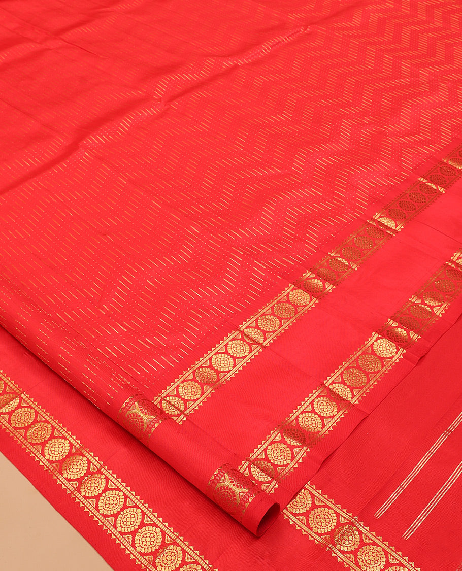 Red Kanchipuram Silk Saree, Woven with Chevron Zari Buttas, Highlighted by a Zari Rettai Pettu Border of Rekku, Banaras, and Chakram Design, Grand Pallu, and No Blouse