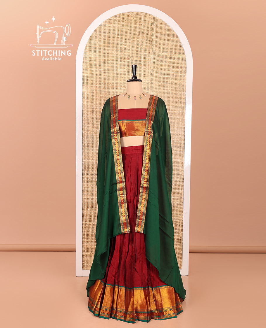 Maroon and Green Mercerised Cotton Half-Saree Featuring Plain Skirt, Adorned with a Contrast Peacock Eye-Rudraksham Motifs Woven Zari Border, Paired with a Matching Blouse, and Contrast Syska Georgette Dhavani with Zari Border