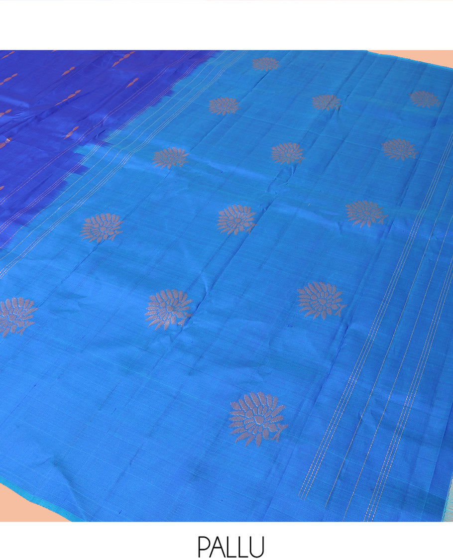 Royal Blue Kanchipuram Silk Saree Adorned with Zari Buttas, Complemented by a Contrast Border of Leaf Zari Designs, Sparsely Zari Woven Pallu, and Paired with a Contrast Blouse