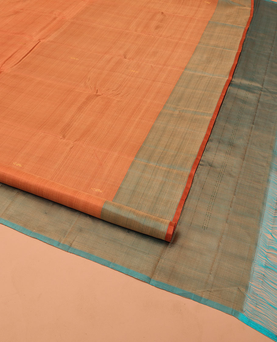 Orange Kanchipuram Silk Saree, Adorned with Zari Buttas All Over Its Body, Complemented by a Contrast Border of Manga Designs, Pallu of Manga Designs, and Paired with a Contrast Blouse