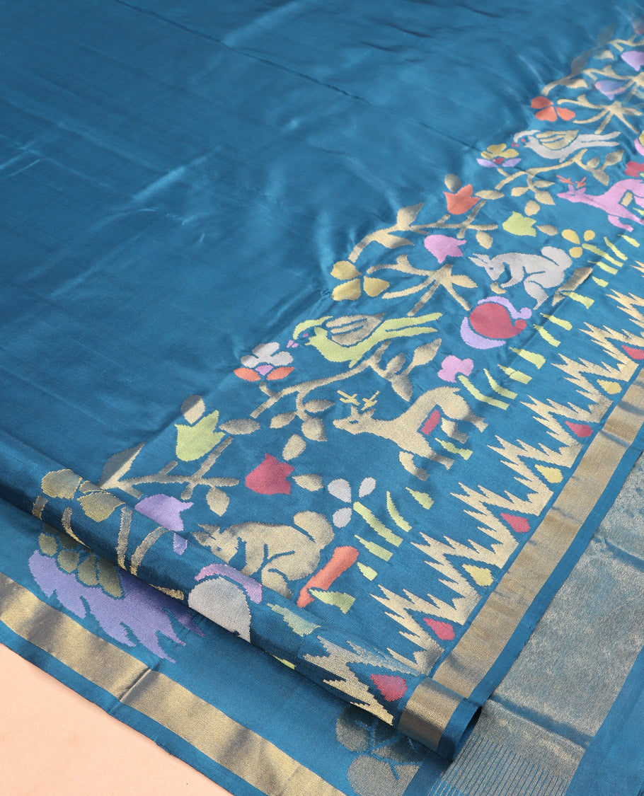 Blue Uppada Silk Saree, Elevated with Meena Flora-Fauna Designs, a Zari Border, and a Plain Blouse