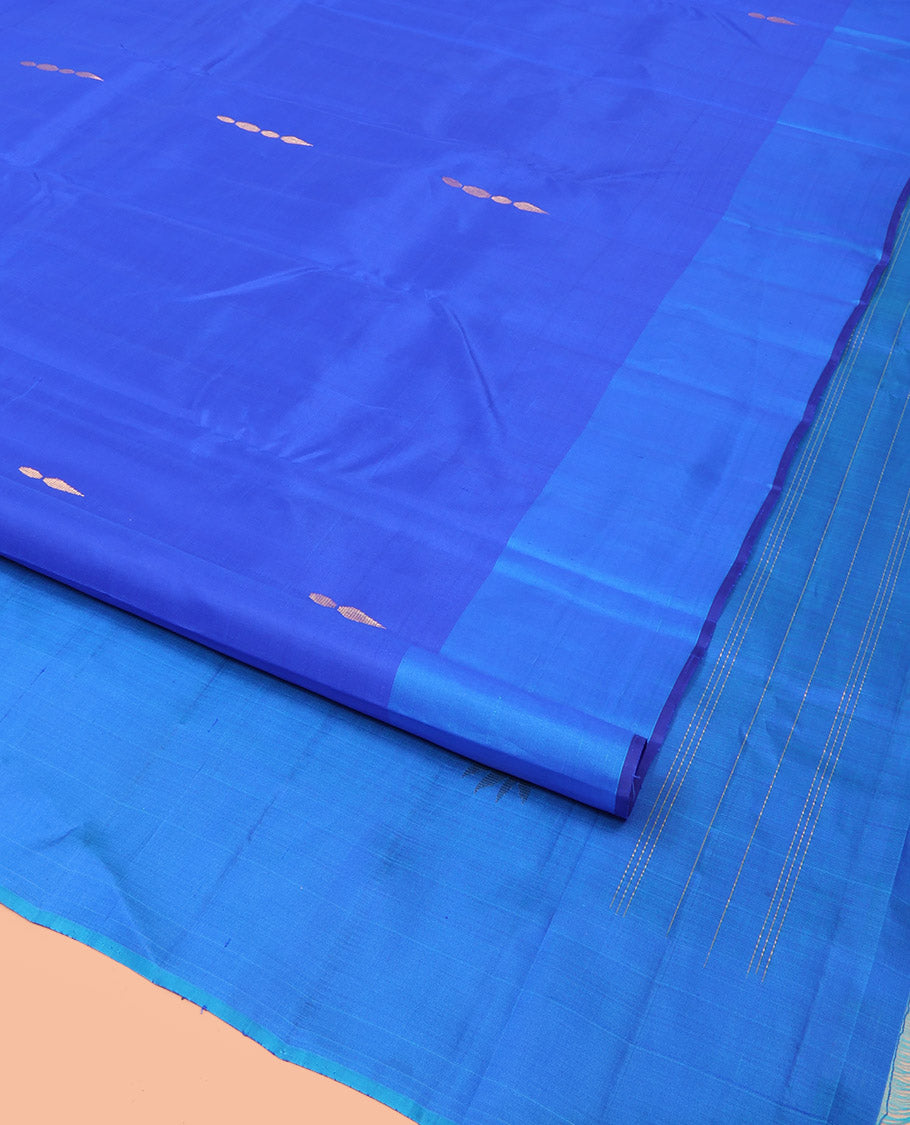 Royal Blue Kanchipuram Silk Saree Adorned with Zari Buttas, Complemented by a Contrast Border of Leaf Zari Designs, Sparsely Zari Woven Pallu, and Paired with a Contrast Blouse