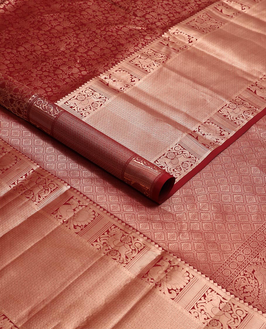 maroon floral jacquard kancheepuram silk saree with self border of thilakam mokku, muthu, banaras, mayil design & zari design pallu