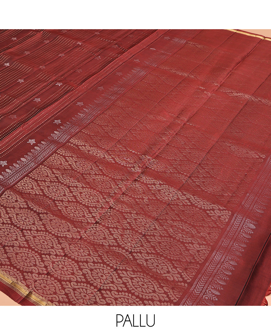 Maroon Mayuri Lite Silk Mix Saree, Adorned with Buttas and Muthu Stripes All Over Its Body, Highlighted by a Zari Border, Pallu of Intricate Designs, and Paired with a Matching Blouse