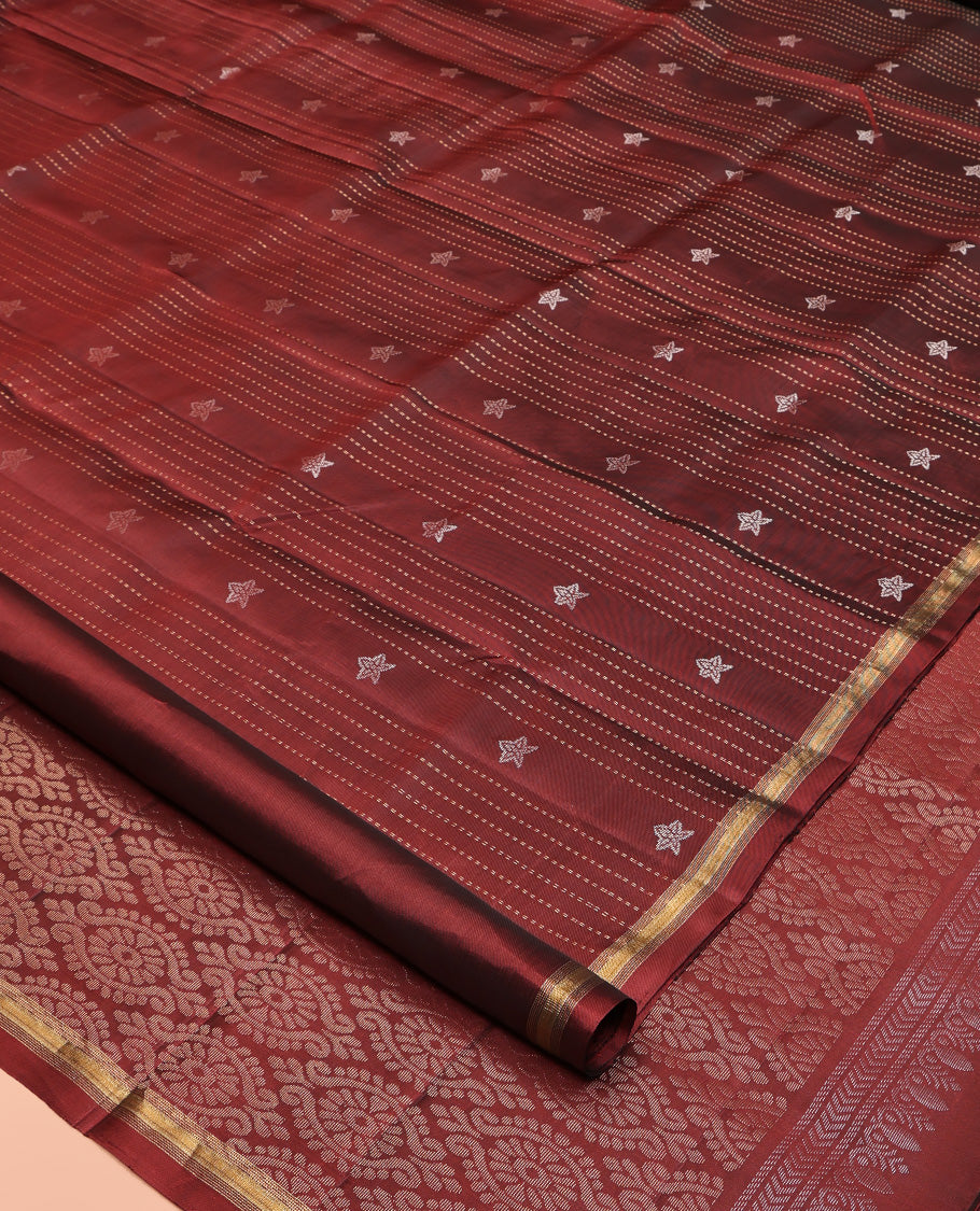 Maroon Mayuri Lite Silk Mix Saree, Adorned with Buttas and Muthu Stripes All Over Its Body, Highlighted by a Zari Border, Pallu of Intricate Designs, and Paired with a Matching Blouse
