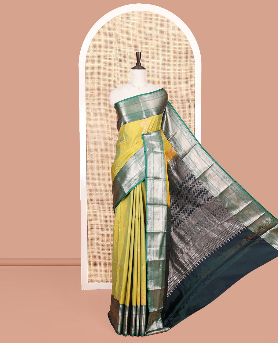 Green Budget Silk Saree, Gracefully Embellished with Zari Buttas All Over Its Body, Complemented by a Contrast Traditional Zari Design Border, Chevron Striped Pallu, and Paired with a Contrast Blouse