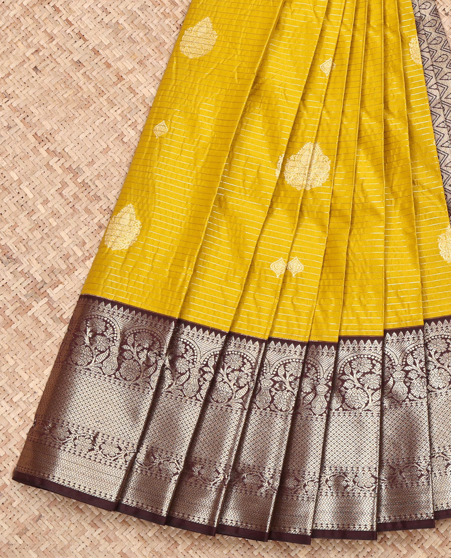 Yellow Budget Silk Saree, Subtly Sparkled with Zari Buttas and Stripes on Its Body, Complemented by a Contrast Traditional Zari Border, Intricately Designed Pallu, and Paired with a Contrast Blouse