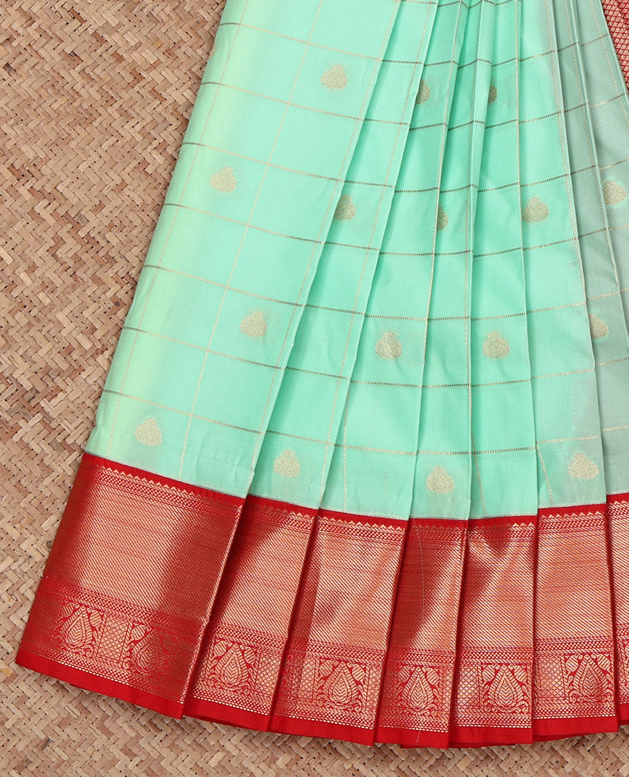 Turquoise Budget Silk Saree, Graced with Zari Butta Enclosed Checks on Its Body, Complemented by a Contrast Traditional Zari Design Border, Grand Jaal Pallu, and Paired with a Contrast Blouse
