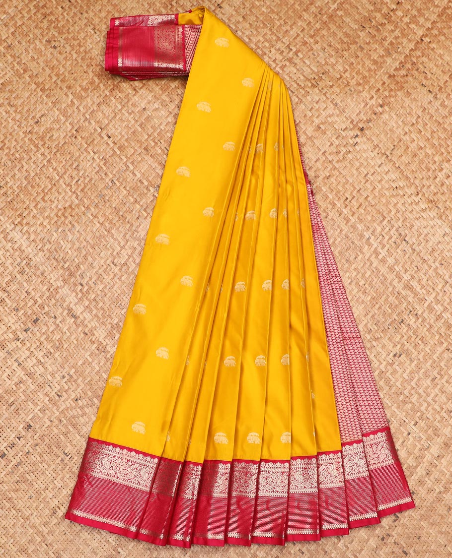 Yellow elephant motifs gift saree, contrast traditional zari design border, and intricate pallu