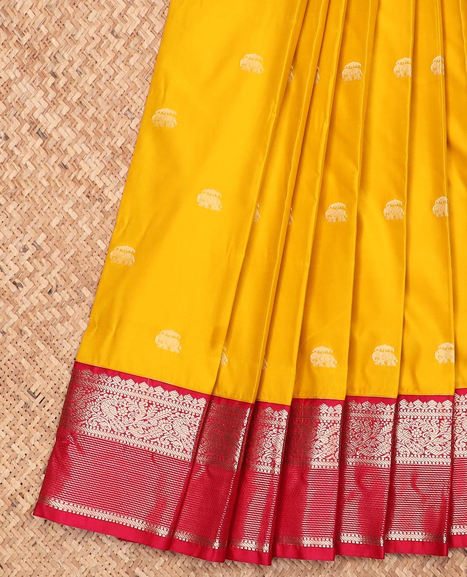 Yellow elephant motifs gift saree, contrast traditional zari design border, and intricate pallu
