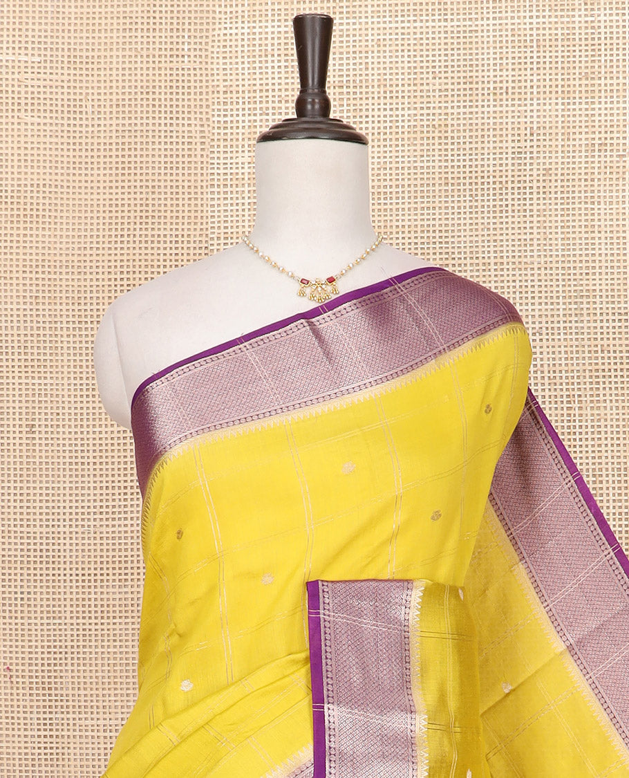 Yellow zari butta enclosed checked Assam silk saree, contrast traditional zari design border, and pallu of zari designs