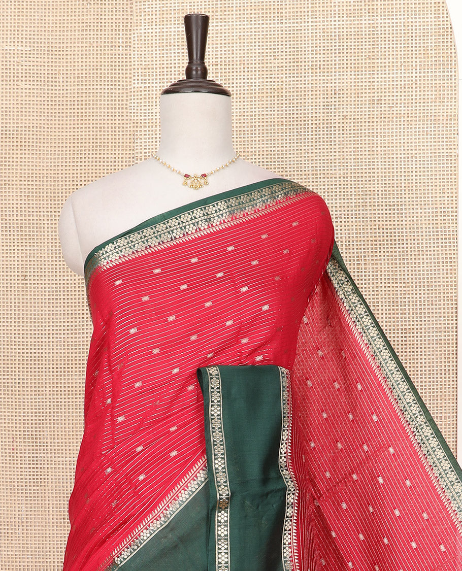 Red Assam Silk Saree Enlivened with Zari Buttas and Stripes, Complemented by a Contrast Traditional Zari Design Border, a Captivating Pallu Featuring Zari Designs, and Paired with a Contrast Blouse