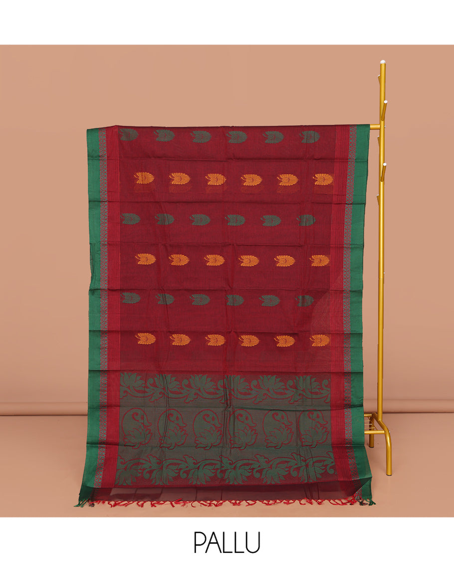 Red Kanchi Cotton Saree, Decorated with Buttas All Over Its Body, Complemented by a Contrast Border, Pallu of Floral and Paisley Designs, and Paired with a Matching Blouse