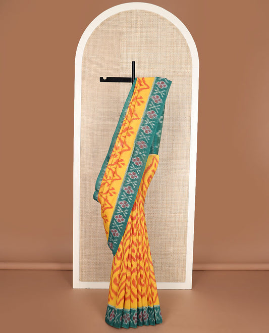 Yellow ogee-patterned ikkat cotton saree, contrast cross & floral motifs ikat border & ikkat design pallu