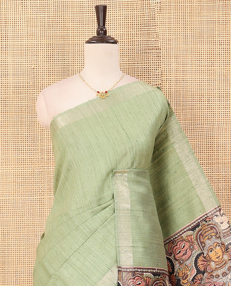 Pista green plain dupion saree, zari border, and contrast pallu of god and goddess figurines print