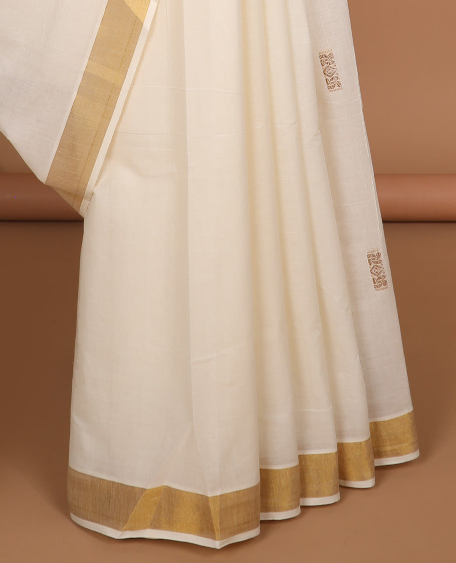 Cream plain kerala saree, plain border & pallu of zari paisley designs