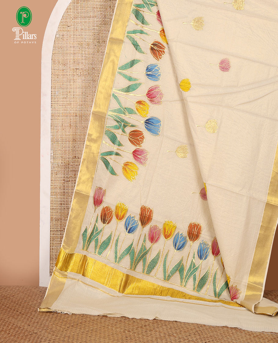 Cream Kerala cotton saree with zari stripes,hand-brush lotus motif painting & embroidery outlines, zari border & zari striped blouse