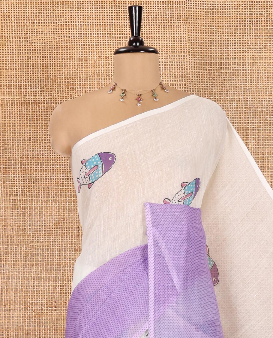 Borderless Cream and Lavender Linen Cotton Saree, Decked Up with Half-and-Half Style Fish Motifs Printed All Over Its Body, Pallu Mirrors the Same Print, and Is Paired with a Contrast Blouse