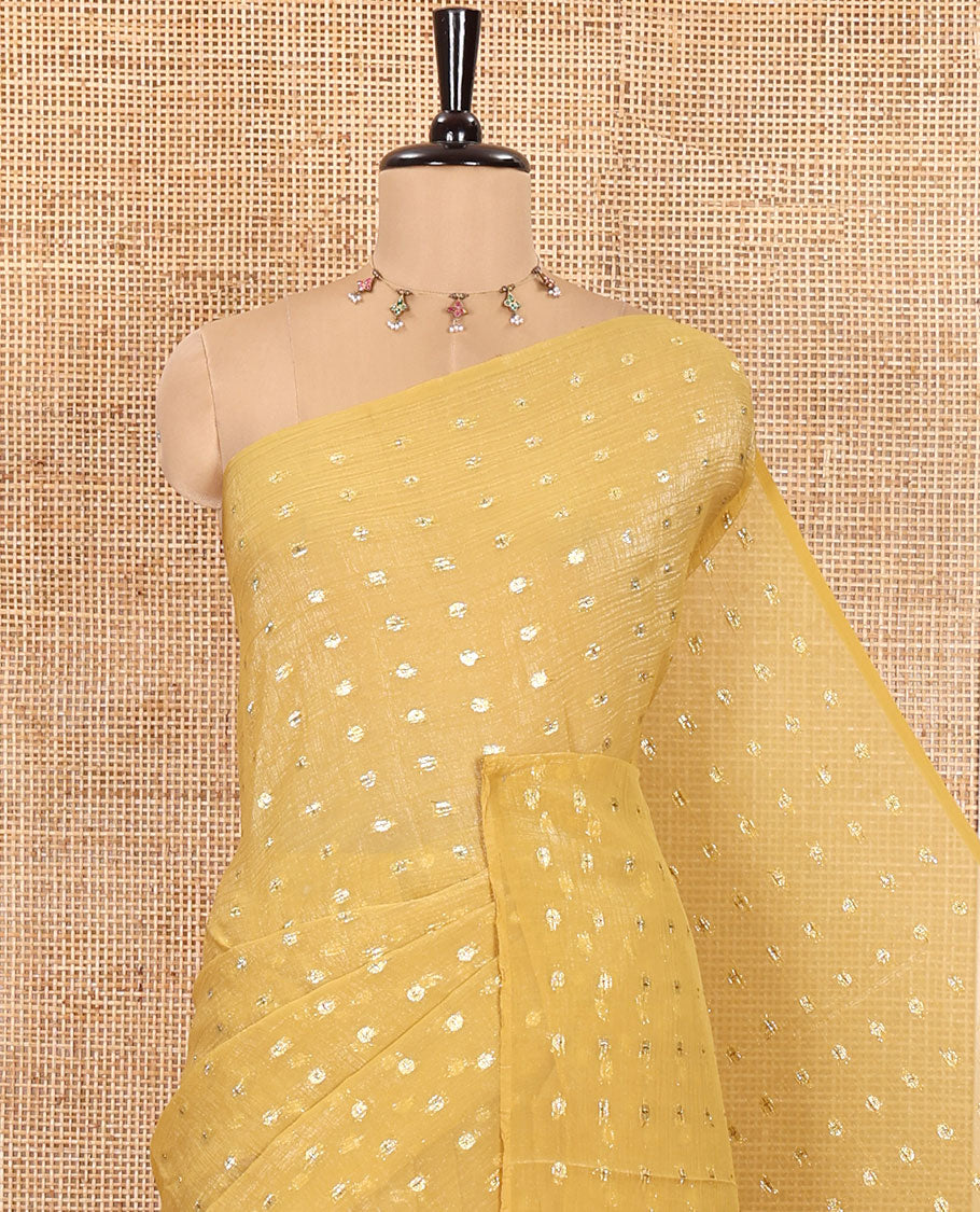 Borderless Mustard Shimmer Saree, Enriched with Zari Buttas All Over Its Body, Pallu Mirrors the Same Buttas, and Comes Without a Blouse