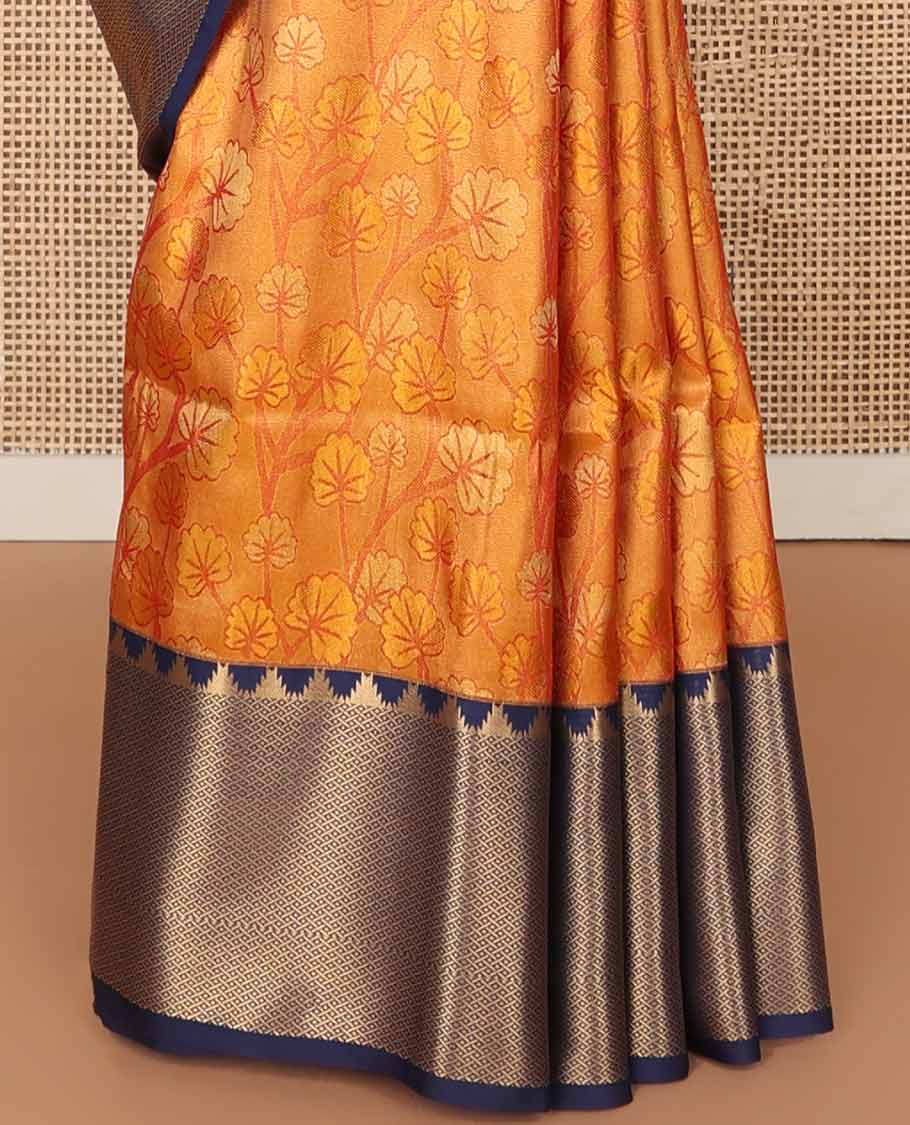 Orange floral design soft silk saree with contrast temple, checked border & floral design pallu