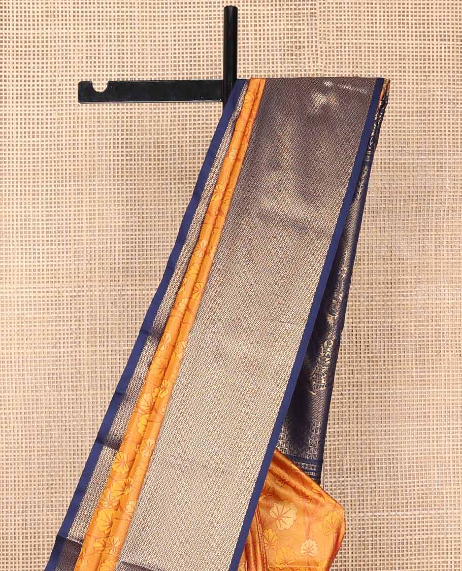 Orange floral design soft silk saree with contrast temple, checked border & floral design pallu