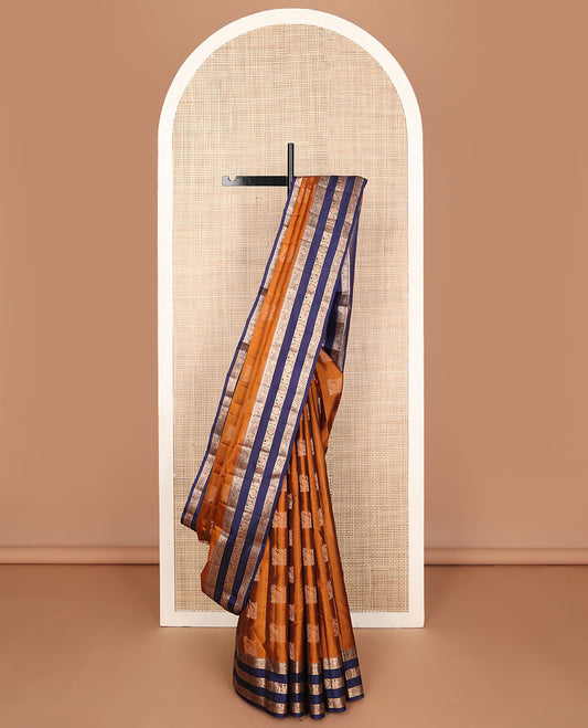 Orange vasundhara elite silk saree with zari buttas, contrast rettai pettu border of kodi visiry & mayil chakram design & pallu steeped with mayil & chakram motifs