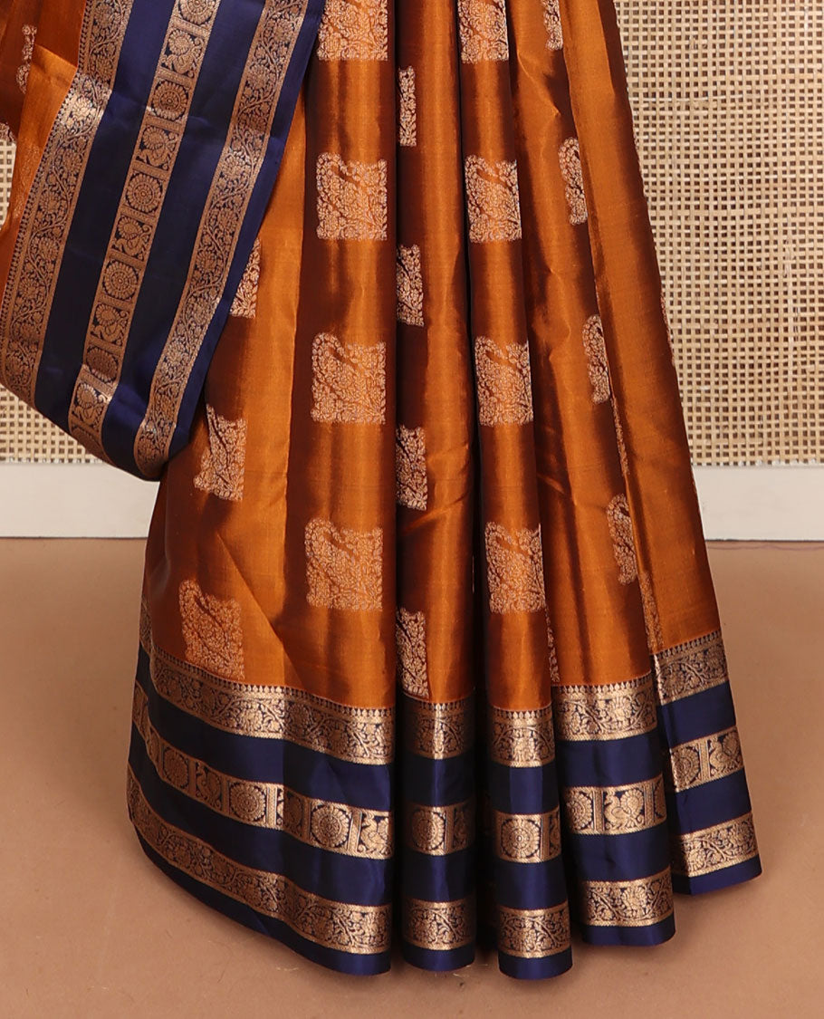Orange vasundhara elite silk saree with zari buttas, contrast rettai pettu border of kodi visiry & mayil chakram design & pallu steeped with mayil & chakram motifs