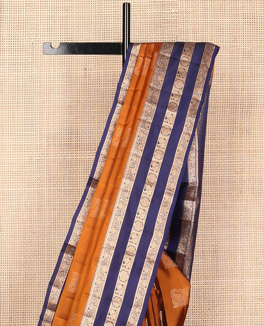 Orange vasundhara elite silk saree with zari buttas, contrast rettai pettu border of kodi visiry & mayil chakram design & pallu steeped with mayil & chakram motifs