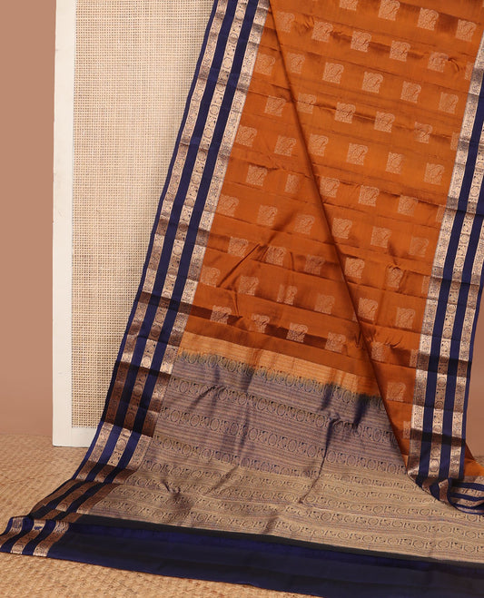 Orange vasundhara elite silk saree with zari buttas, contrast rettai pettu border of kodi visiry & mayil chakram design & pallu steeped with mayil & chakram motifs