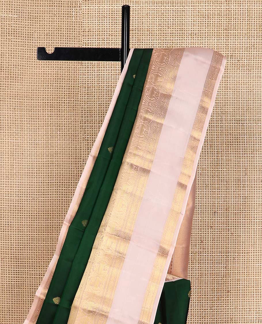 Green zari buttas Vasundhara silk mix saree, contrast rettai pettu border of rekku, kathir, round yaali, and zari designs, and vanki design pallu