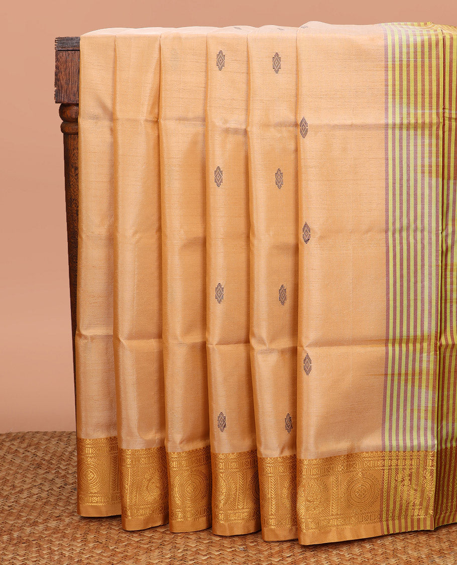 Sandal Banana Pith Saree, Highlighted by Buttas All Over Its Body, Complemented by a Contrast Traditional Zari Border of Peacock-Chakram Designs, Pallu Features Stripes, and Paired with a Contrast Blouse