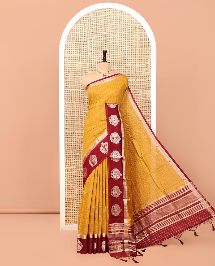 Mustard Assam Silk Saree, Decked Up with Checks, Complemented by Contrast Peacock Design Border, Zari-Striped Pallu, and a Contrast Blouse
