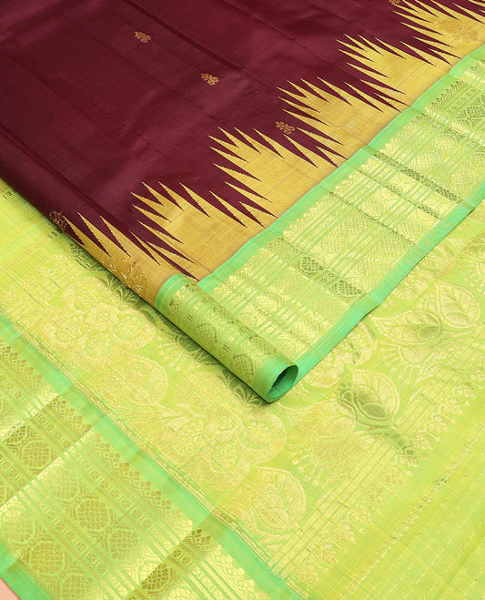 Maroon buttas Kanchipuram silksaree, contrast one-sided temple border of salngai,banaras,cross kamalam & laddu kamalam & floral pallu